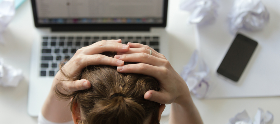 Portrait Woman Grabbing Head Desk Near Laptop